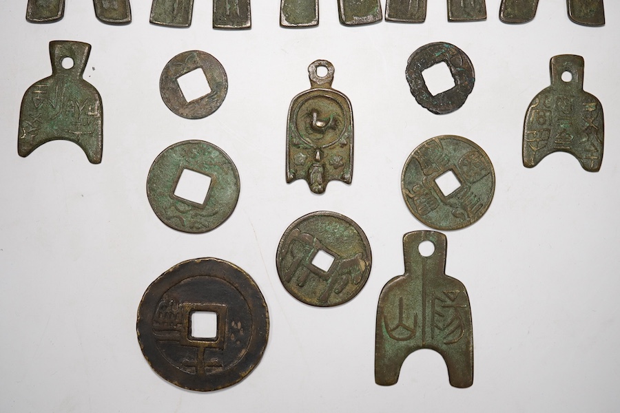 A group of Chinese replica spade coins, a Wu Zhu coin, and others